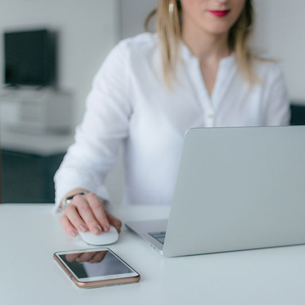 Professional administrator accessing AFMA’s online resources for residency program management.